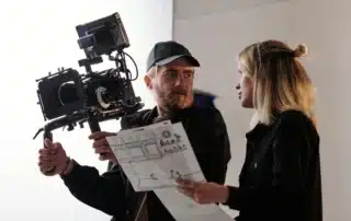 Learn how to script a 60 second brand video that converts viewers into customers. Clear messaging, strong hooks, and a focused call to action matter. A director and filmmaker reviewing a storyboard shows the value of planning every scene.