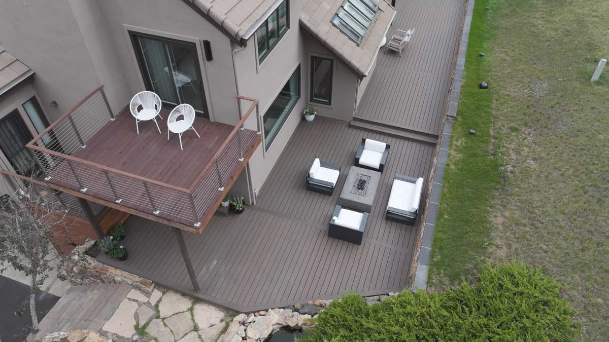 Real Estate Videography Denver Colorado Modern patio with wooden decks and seating areas. - Real Estate Videography Denver Colorado